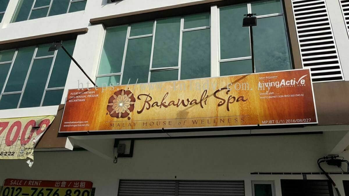 The Bakawali Spa shop sign above the ground floor of a row of shophouses.